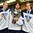 GRAND FORKS, NORTH DAKOTA - APRIL 24: Finland's Urho Vaakanainen #7, Kasper Kotkansalo #36 and Emil Oksanen #23 celebrate with the trophy after a 6-1 victory over Sweden during gold medal game action at the 2016 IIHF Ice Hockey U18 World Championship. (Photo by Matt Zambonin/HHOF-IIHF Images)